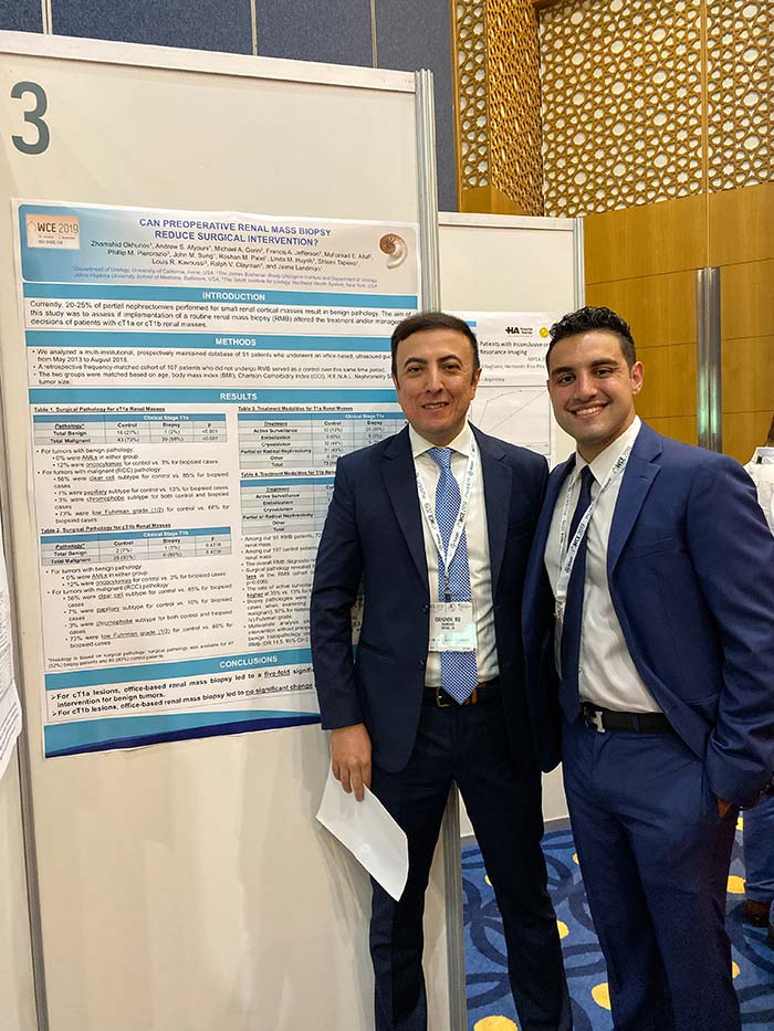 Zhamshid Okhunov, M.D. and Andyshea Afyouni by poster